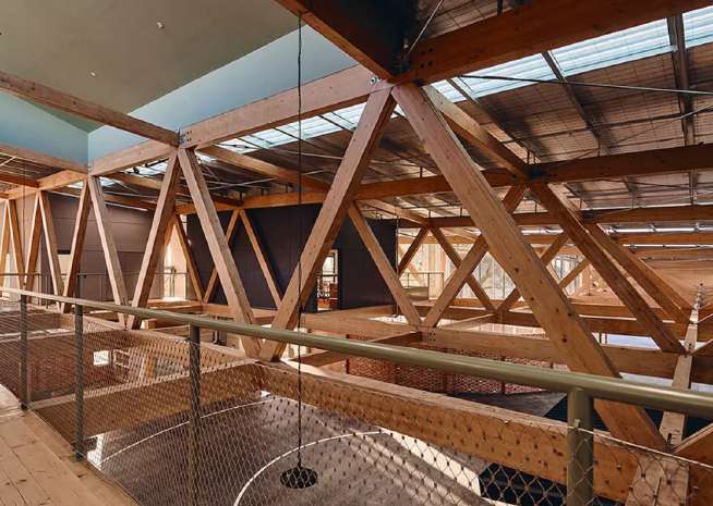 Repeating glulam trusses forming the upper level